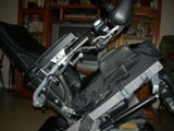 passinger and wheelchair securement maximum rear tilt of seat cushion